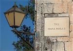 Croatia, Trogir, Central Europe. Detail of lamp and street name. UNESCO