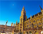 Germany, Bavaria; Munich; Marienplatz; Low view of Town hall (Rathaus) and Frauenkirche at dusk