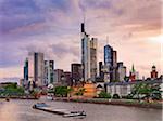 Germany, Hessen, Frankfurt Am Main, Financial district, Boat on river Main at dusk