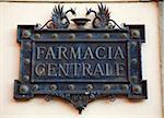 Italy, Tuscany, Lucca. An ornamented sign for a pharmacy