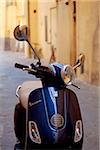 Italy, Tuscany, Lucca. A motorino in one of the narrow streets in the historical centre