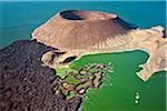 The perfectly shaped volcanic cone called Nabuyatom juts into the jade waters of Lake Turkana at the inhospitable southern end of the lake, known as Von Hohnel Bay.