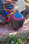 Towards the end of a Sapana ceremony, every man present will drink from a wooden vessel