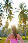 Malaysia, Langkawi, Woman infront of palm trees