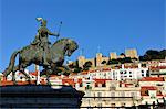 The historical centre and the Sao Jorge castle, with King Dom Joao I equestrian statue. Lisbon, Portugal