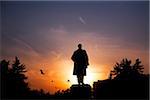 Sakhalin, Yuzhno-Sakhalin, Russia; Silhouette of a monument to Lenin in the main sqaure