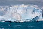 A tabular iceberg in rough seas off Cumberland Bay in South Georgia.
