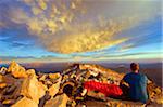 Europe, Spain, Pyrenees, Pico de Aneto  (3404m), highest peak in mainland spain, climber looking at sunrise view