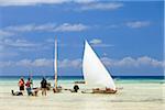 Tanzania, Zanzibar, Unguja Island, Kizimkazi. Fishermen returning with the incoming tide.