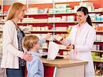 Pharmacist filling prescription in store