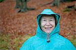 Senior woman wearing waterproof clothing and smiling