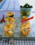 Potato salad in bowls on tray of ice