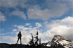 Woman admiring mountain view, Picket Range, North Cascades National Park, Washington, USA