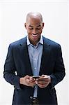 African American man using cellphone, studio shot