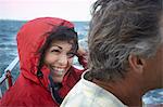 Mature couple sailing, close up