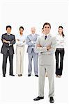 Smiling multicultural business team with their arms folded focus on a man in foreground