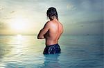 Man standing in tranquil sea