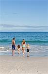 Young family spending their day on the beach