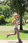 Side view of a running young sportswoman