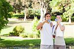 Young sports people drinking some water