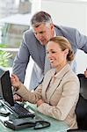 Businesswoman working with a colleague in a office