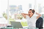 Tanned businesswoman extremely happy in a bright office