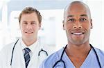 Young male doctors standing in line