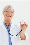 Stethoscope being used by smiling mature doctor