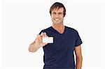 Smiling man holding a blank business card against a white background