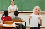 Smiling little girl presenting her test results