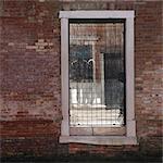 People reflected in broken window, Cannaregio, Venice.