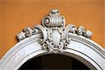 Carved stone cartouche above doorway in Madeira, Portugal.