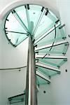 Moonraker. The steel and glass spiral staircase. Looking up through the glass treads. Architects: Paul Humphries Architects