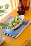 Fresh Green Apples In Fruit Bowl On Book