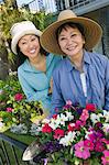 Mother and daughter in garden, (portrait)