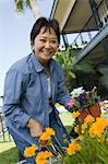 Woman gardening, (portrait)