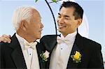 Groom with father, outdoors, (close-up)