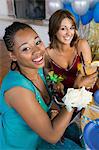 Well-dressed teenage girls drinking at school dance, elevated view