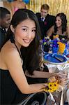 Well-dressed teenager girl sitting at school dance