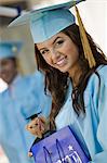 Graduate with Gift Bag outside, portrait