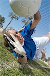 Girl Catching Soccer Ball