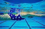 Female swimmer underwater in pool