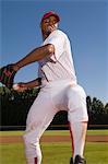 Baseball pitcher throwing ball during game