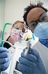 Dentist and hygienist in surgery, (close-up)