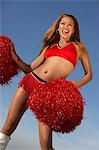 Cheerleader with pom poms