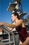 Female swimmer exiting pool