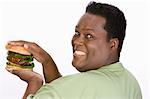 Man Holding Hamburger