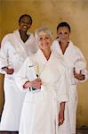 Portrait of three women in bathrobes