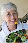 Portrait of senior woman eating healthily