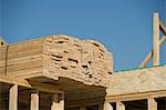 Wooden planks stacked on house construction